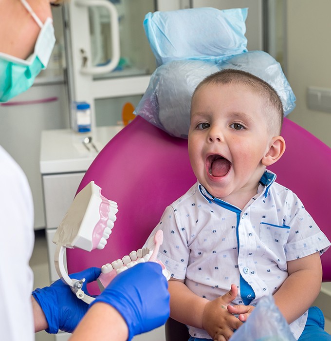 Little boy happy at first children's dentistry visit