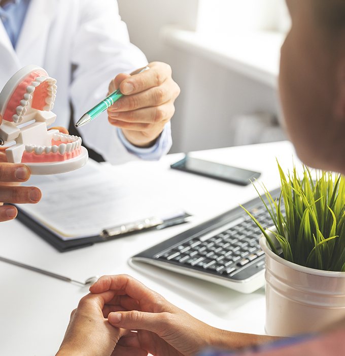 Dentist and patient reviewing dental treatment plan