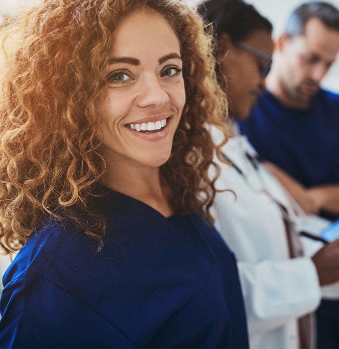 Smiling dental team member