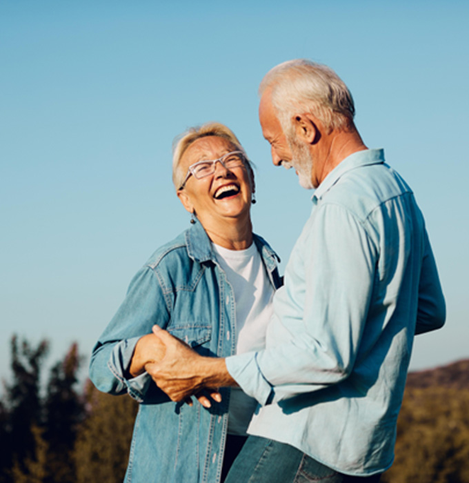 Older couple smiling and laughing together 