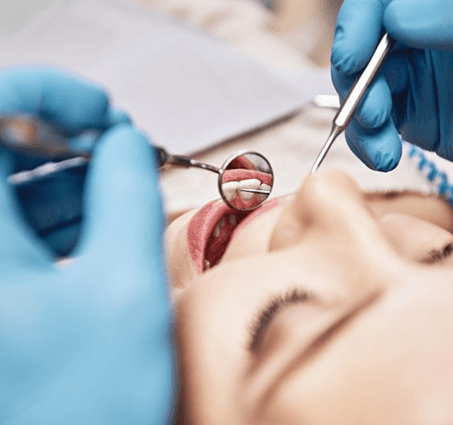 a patient having their teeth checked for cavities