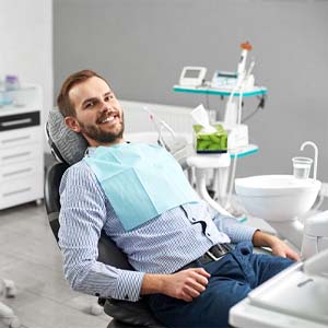 Man with dental implants in Muskegon, MI sitting in dental chair