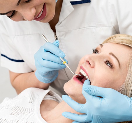 Patient receiving preventive dentistry exam
