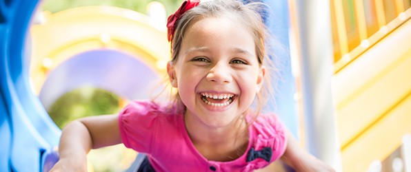 Little girl with healthy smile after children's dentistry