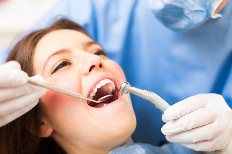 dentist inspecting patient during dental checkup