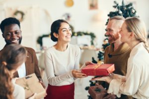 friends smiling and celebrating the holidays