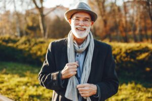 Man with denture smiling during the holidays